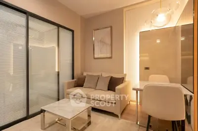 Modern living room with cozy sofa, elegant decor, and stylish lighting in a contemporary apartment.