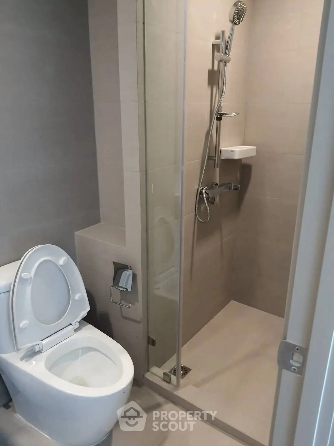 Modern bathroom with sleek shower and toilet in minimalist design