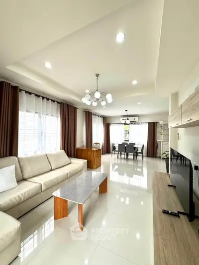 Spacious modern living room with elegant decor and ample natural light