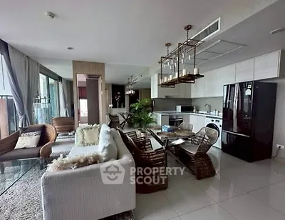 Luxurious open-plan living room with modern kitchen and stylish decor