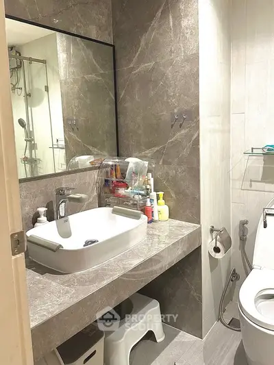 Modern bathroom with sleek design and marble accents