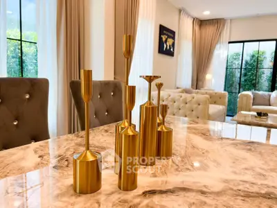 Luxurious living room with elegant marble table and plush seating