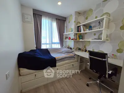Cozy bedroom with built-in storage and study desk, featuring modern decor and natural light.
