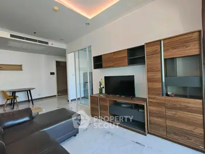 Modern living room with sleek furniture and marble flooring