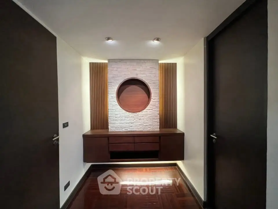 Elegant hallway with modern wooden accents and ambient lighting