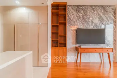 Modern living room with stylish wooden furniture and marble accent wall