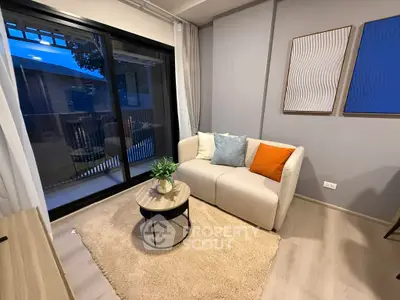Cozy modern living room with stylish decor and balcony view