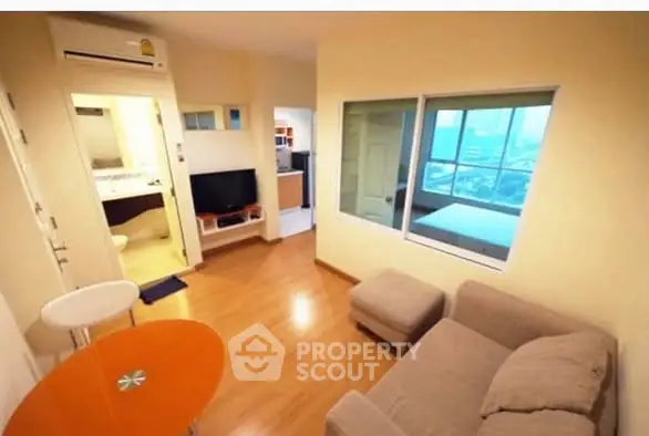 Cozy living room with modern decor and city view window