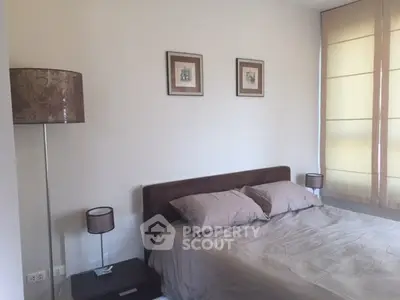 Cozy bedroom with elegant decor and soft lighting, perfect for relaxation.