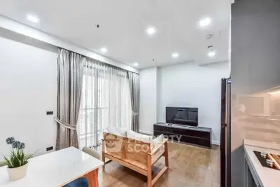 Modern living room with wooden flooring and natural light