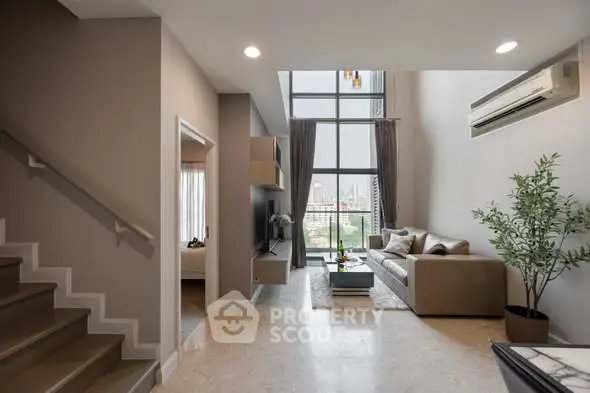 Modern living room with high ceiling and city view, featuring elegant decor and natural light.