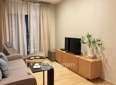 Modern living room with sleek furniture and cozy ambiance, perfect for relaxation and entertainment.