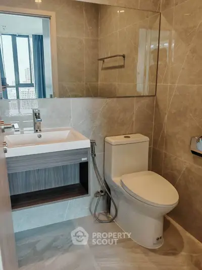 Modern bathroom with sleek fixtures and city view window