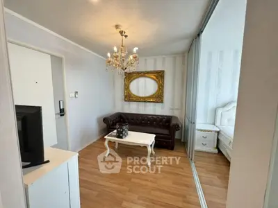 Elegant living room with chandelier and classic decor in modern apartment