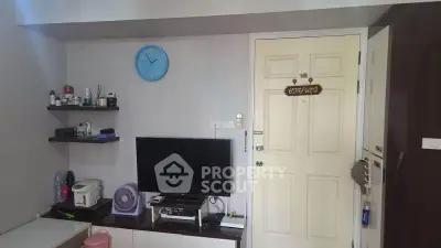 Cozy living room with wall-mounted TV and modern decor