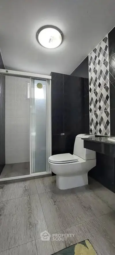 Modern bathroom with sleek design and stylish tile accents