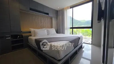 Luxurious bedroom with modern design and scenic mountain view from large window.