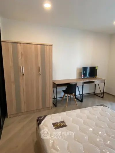 Modern bedroom with sleek furniture and cozy ambiance