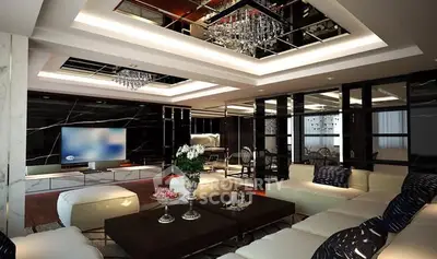 Luxurious modern living room with elegant chandelier and spacious seating area.