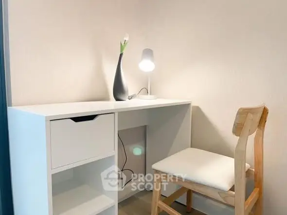Cozy study nook with modern desk and chair, perfect for productivity.