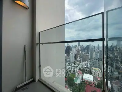 Stunning high-rise balcony with panoramic city view, perfect for urban living.