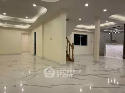 Spacious modern interior with marble flooring and elegant lighting, ideal for luxurious living.