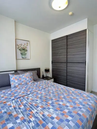 Modern bedroom with stylish bedding and sleek wardrobe design