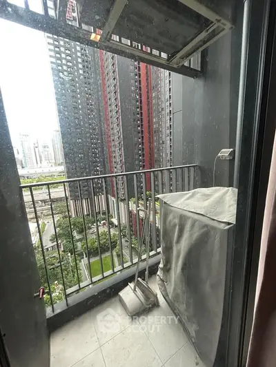 Urban balcony with city view, perfect for enjoying skyline vistas and fresh air in a modern high-rise setting.