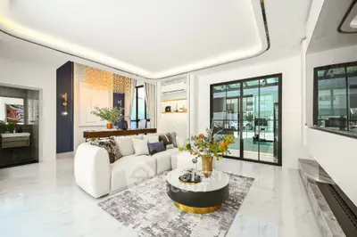 Luxurious modern living room with elegant decor and large windows