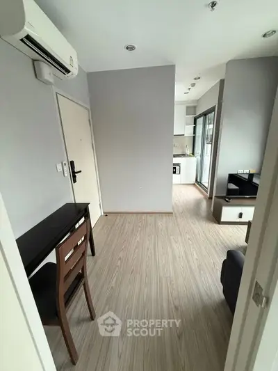 Modern apartment interior with open layout and sleek kitchen design