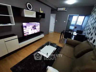 Modern living room with stylish decor and wall-mounted TV