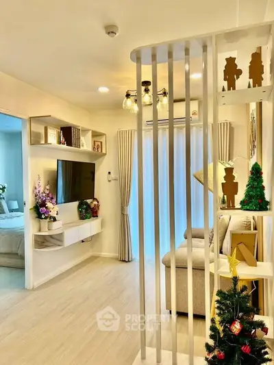 Stylish living room with modern decor and festive touches, featuring a cozy sofa and wall-mounted TV.
