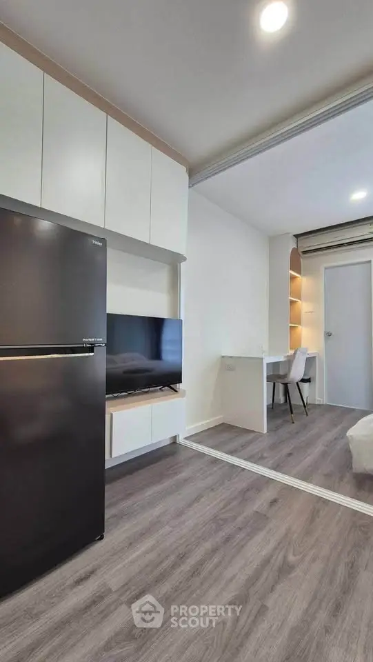 Modern apartment interior with sleek kitchen and cozy living area