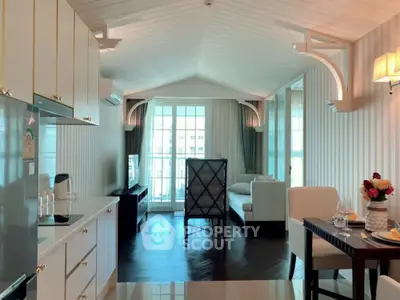 Elegant open-plan living room with modern kitchen and stylish decor