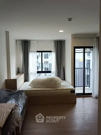 Modern bedroom with balcony view in a stylish apartment
