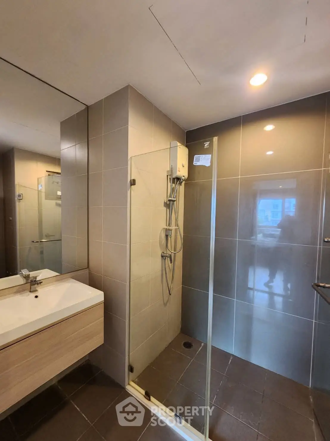 Modern bathroom with glass shower and sleek vanity