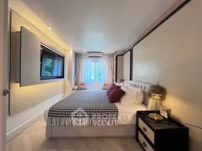 Luxurious modern bedroom with stylish decor and ample natural light