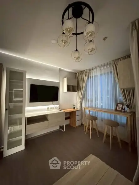 Stylish modern living room with elegant lighting and cozy seating area.