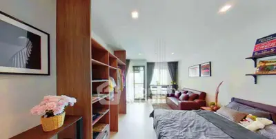 Modern bedroom with stylish decor and open layout in a contemporary apartment.