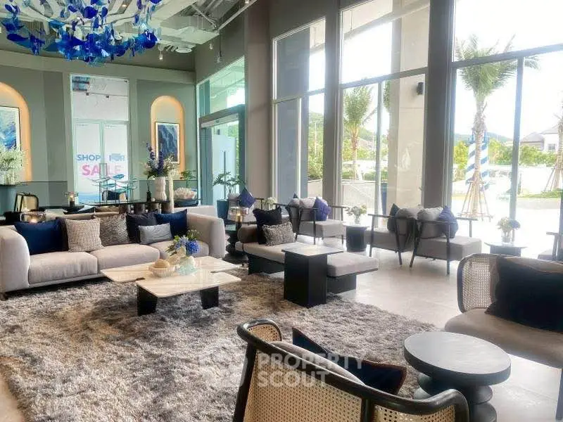 Luxurious modern living room with plush seating and large windows offering stunning views.