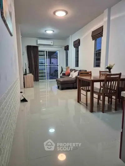 Spacious modern living room with sleek furniture and natural light