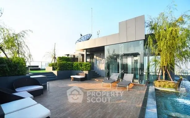 Luxurious rooftop terrace with modern design and poolside seating area.
