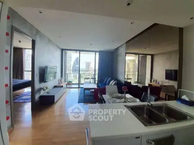 Modern open-plan living room with city view and stylish decor