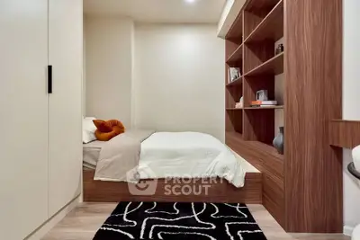 Modern bedroom with built-in wooden shelves and cozy bed setup