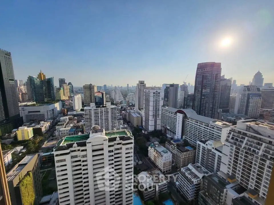 Stunning cityscape view from high-rise building showcasing urban skyline and architecture.