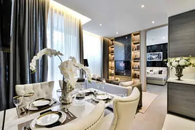 Luxurious open-plan living and dining area with elegant decor and natural light.