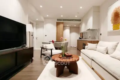 Modern living room with stylish furniture and ambient lighting, perfect for relaxation and entertainment.