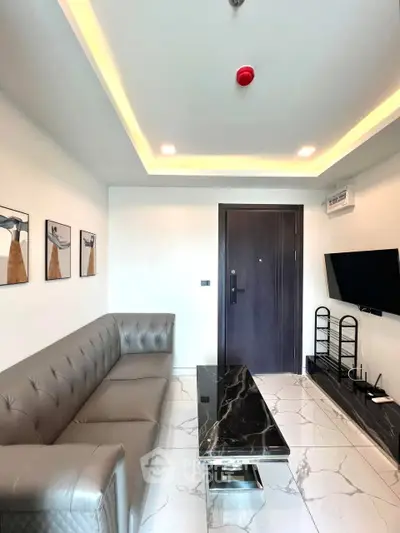 Modern living room with sleek furniture and marble accents