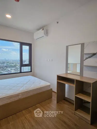 Modern bedroom with city view, featuring a minimalist design and wooden flooring.