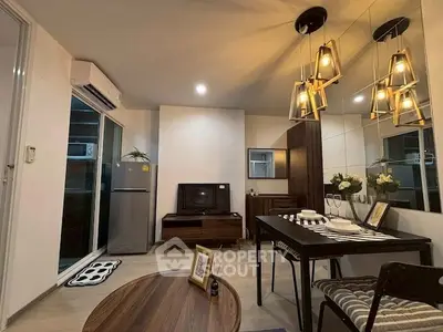 Modern living room with stylish decor and open layout, featuring dining area and cozy ambiance.